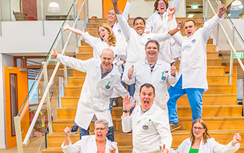10 Mad Scientist posing on the stairs