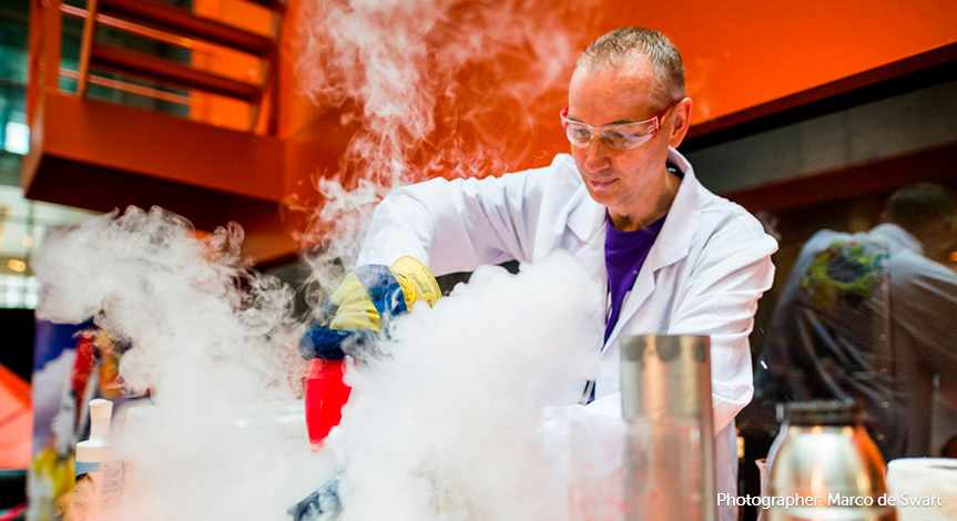 Mad Scientist working in a lab with tons of smoke pouring out of beakers